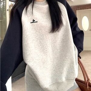gray and black raglan crewneck sweater